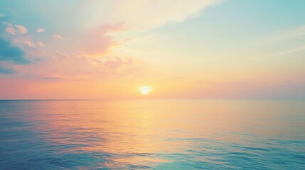 Serene ocean sunset with pastel skies and calm water reflections.