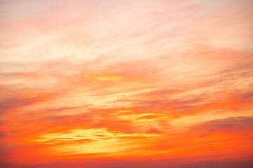 Fototapeta premium Sky,sunset, beautiful , luxury soft gradient orange gold clouds and sunlight on the blue sky perfect for the background, Sunrise on morning or everning in winter warm time ,Twilight summer,silhouette