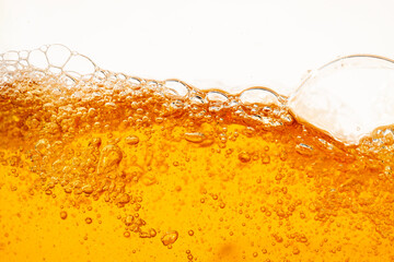 Close up bright orange Oil or beer splash texture and nature waves, Beautiful waves curve and...
