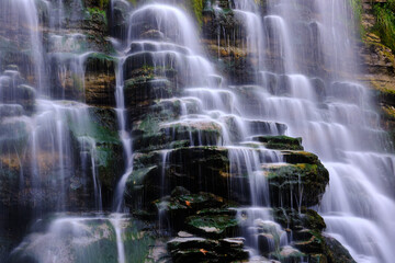 Fairy Alferello falls in The National Park of the Casentino Forests with silk effect during autumn season during a trekking, walking in Italy, Emilia-Romagna hills, relaxing and loud water