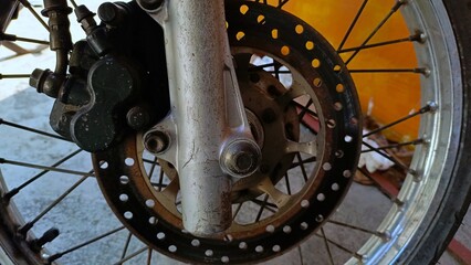 Close up - wheel spokes and brake disc of a motorcycle.Technology