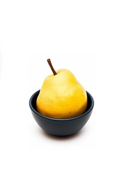 Yellow pear in a bowl; Yellow pear in a deep plate