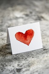 Fototapeta premium Watercolor heart design on handmade greeting card