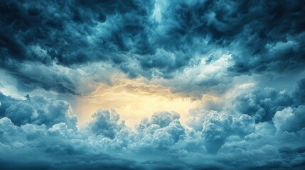 Obraz premium Dark, dramatic clouds swirl ominously, with a hint of light breaking through, creating a striking contrast in the sky.