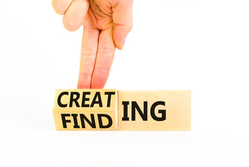 Finding or creating symbol. Businessman turns wooden cubes and changes words Finding to Creating. Beautiful white table white background copy space. Business creating or finding concept.