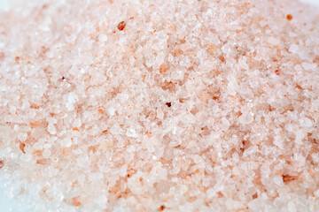 Pink himalayan salt on white background