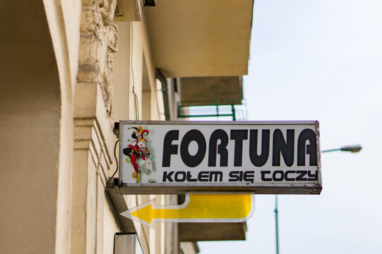 Close-up shot of Fortuna games of chance office sign on a building