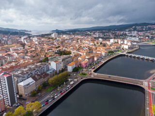 Aerial drone perspective of Pontevedra city. Famous travel destination in Galicia. River Lerez. Downtown of Pontevedra. Panoramic view of all region. Famous travel destination in Spain.