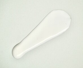 White lotion cream swatch texture isolated on horizontal white background.
