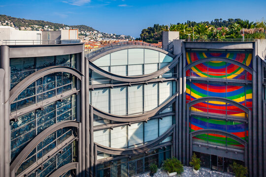 NICE, FRANCE - AUGUST 29, 2019: inner courtyard and glass facades of "Musee d'art moderne et d'art contemporain", called MAMAC, Museum of Modern and Contemporary Art, wall painting by Sol LeWitt