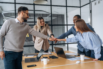 Supporting each other, team is together. Professional workers are in the modern office