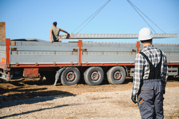 Fototapeta premium male engineer construction checking and maintenance of parts of construction crane at construction site