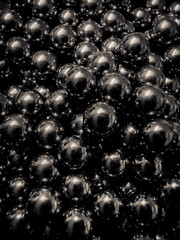 Pile of black shiny magnetic balls.