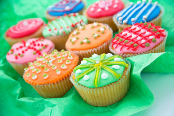 Colourful decoratively iced cupcakes still life