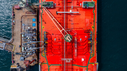 Aerial view oil tanker ship oil depot terminal storage petroleum petrochemical refinery product,...