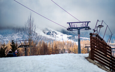 Ski Lift Over Snowy Mountain Landscape in Winter