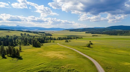 Fototapeta premium Scenic rural landscape with winding road and clouds