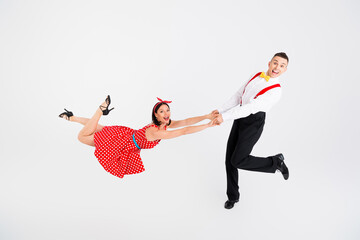 Photo of attractive couple professional dancers choreographers hold hands dance lift jazz funk...