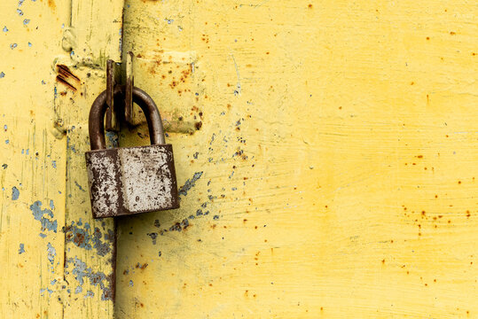 Old rusty lock on metal doors. Lock on the door with an empty place for an inscription
