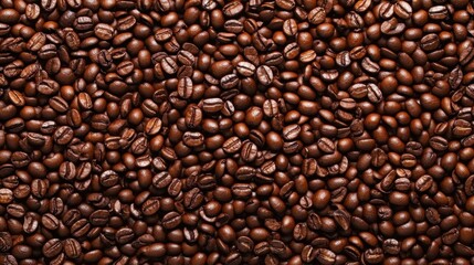 Fototapeta premium Close-up view of a pile of roasted coffee beans, filling the frame