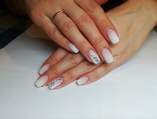 Woman's hands with French manicure