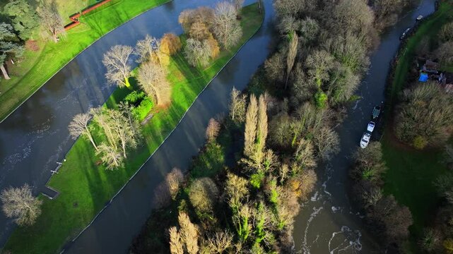 Aerial shot of river Thames and trees in low winter sun at Hurley