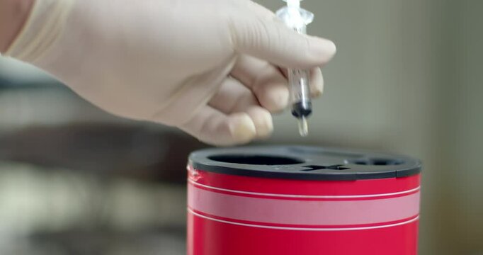 Wear white gloves and discard the syringe.Remove the needle from the syringe.Syringes that have been used must be disposed of properly.	