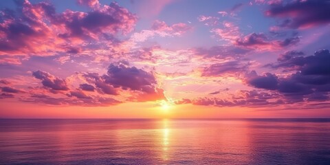 Fototapeta premium A beautiful summer sunset sky with pink, orange, and purple hues casting a soft glow over the landscape.