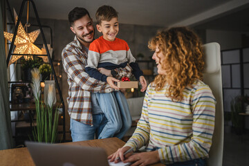 Dad and son surprise mum with gift while she work from home