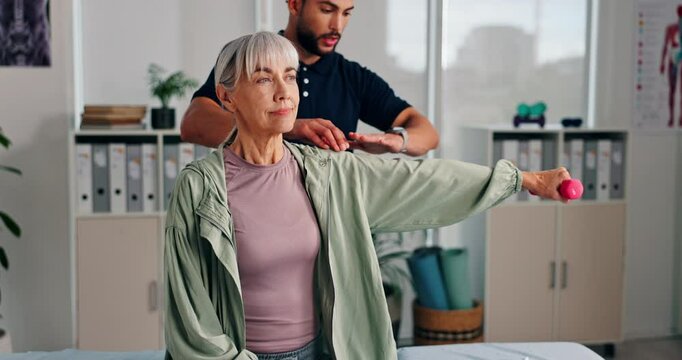 Clinic, physiotherapist and old woman with dumbbells for stretching, wellness and fitness for healing. Rehabilitation, patient and expert with help for physiotherapy, weightlifting and arm exercise