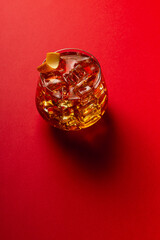 Vertical view top angle of an ice tea on a red table