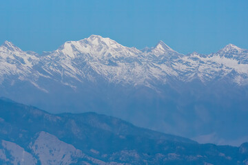 Fototapeta premium A beautiful view of Garhwal mountain range during the sunset from the outskirts of Chopta, Uttarakhand
