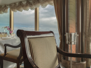Formal and elegant ocean view Art Deco dining room restaurant onboard luxury cruiseship or cruise...