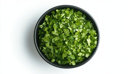 Fototapeta premium Lush green cilantro fills a sleek black bowl, showcasing its finely chopped leaves. This aromatic herb awaits its moment to elevate dishes with its unique flavor, ideal for various cuisines