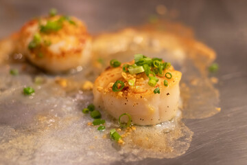 Delicious cooked scallops with spices and herbs.