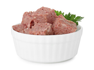 Canned meat with fresh parsley in bowl isolated on white