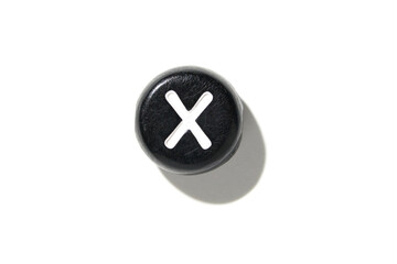 Fototapeta premium Minimalist black button with white x symbol on clean white background casting soft shadow