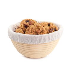 Delicious oatmeal cookies with dried cranberries and nuts in bowl isolated on white