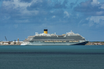 Modern mega family cruiseship cruise ship liner Firenze docked at pier near Hamilton, Bermuda on...