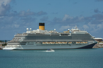 Modern mega family cruiseship cruise ship liner Firenze docked at pier near Hamilton, Bermuda on...