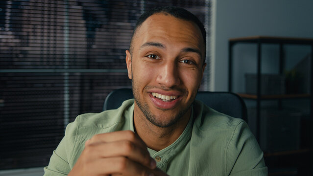 Close-up smiling african american man businessman male corporate employee manager talking video call using laptop computer in office remote conversation online conference webinar business negotiating