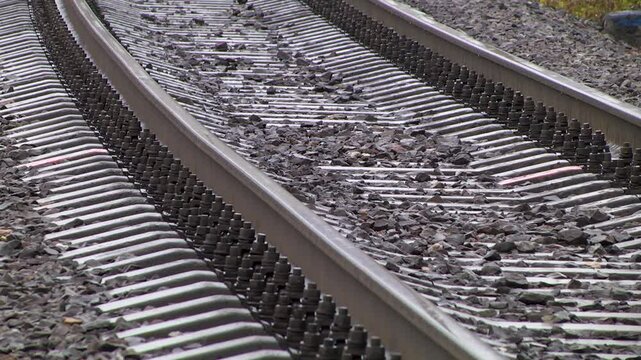 Railway rails with concrete sleepers. Close-up.