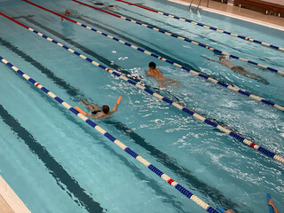 Swimming laps in an indoor pool