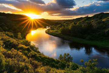 A golden sunset over a calm river winding through a peaceful valley