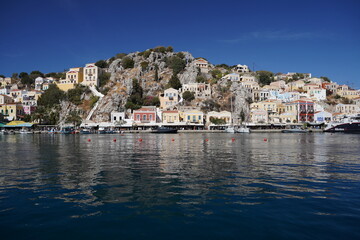 Fototapeta premium boats in the picturesque and beautiful waters of Symi island marina