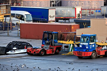 Fototapeta premium Various types of vessels calling at the port and moored at the berth. Tugs in the port. Mersin, Turkey, 2024