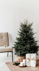 Living room with christmas tree and gift boxes. Minimalistic scandi style New Year interior. Cozy family holidays.