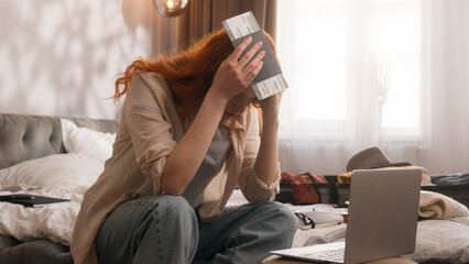 Caucasian confused worried woman girl female at bedroom check time laptop computer booking hotel...