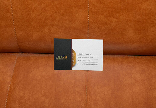 Business Card Resting on a Brown Suede Surface