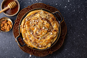 Phyllo pastry pie with pear, gorgonzola cheese, almond and honey, top view